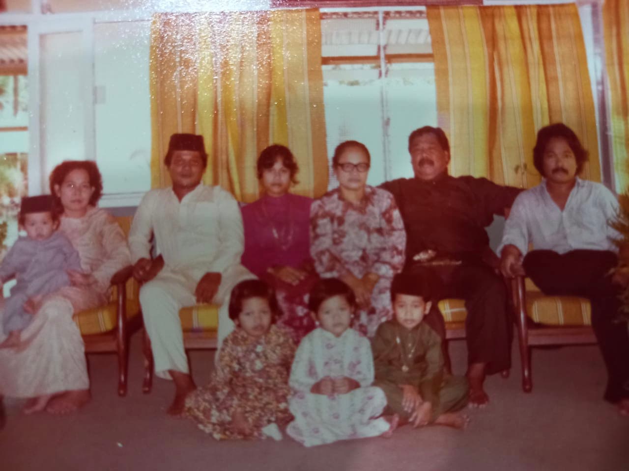 Jazi as a child with his family during eid holiday